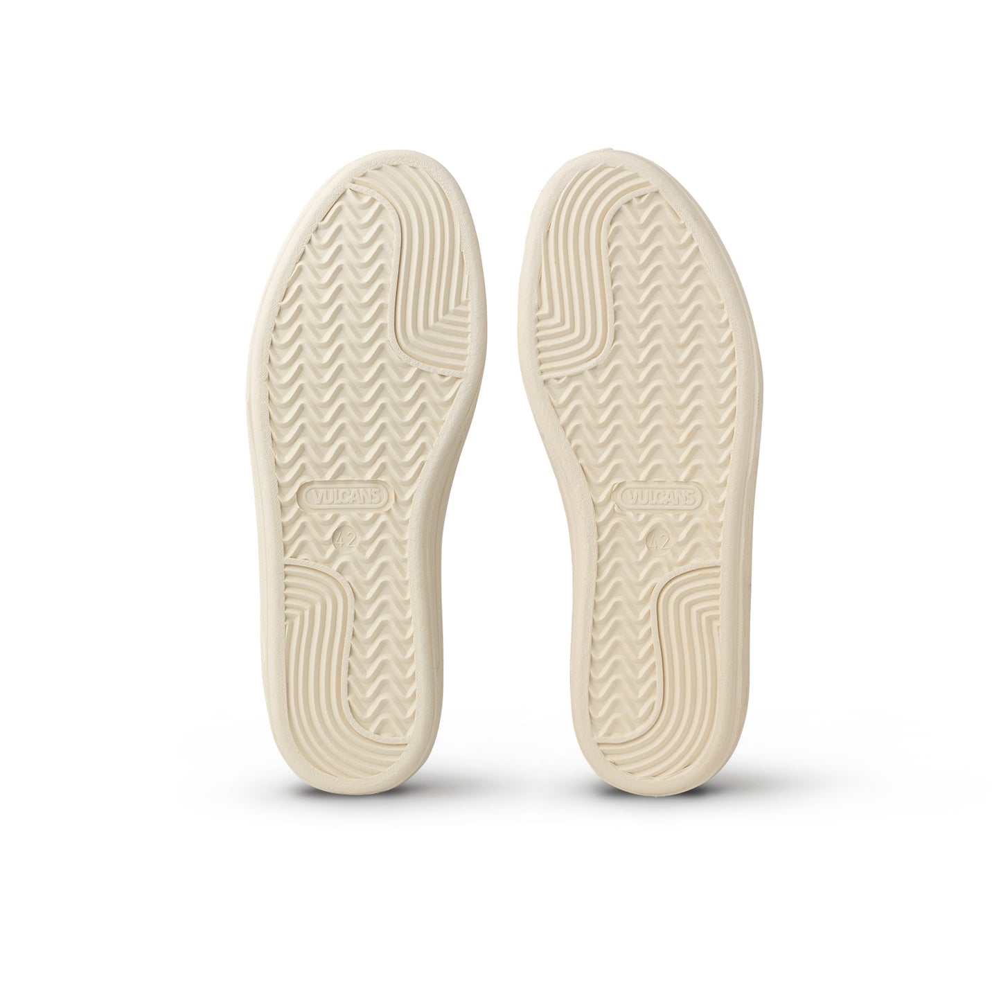 Close-up of beige rubber shoe soles.