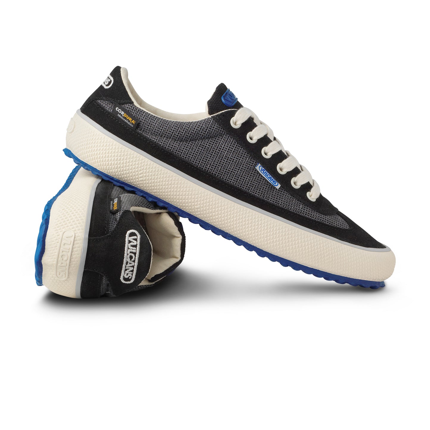 Black sneakers with white rubber soles. Cordura fabric.
