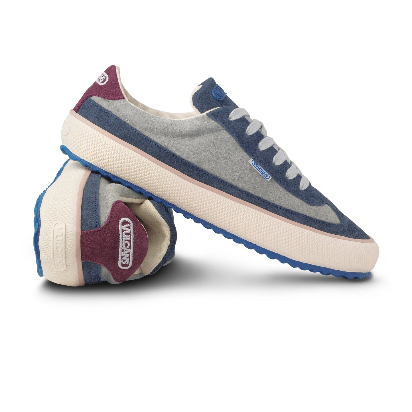 Pair of blue and gray sneakers. Vulcans logo embroidery on heel tab. 